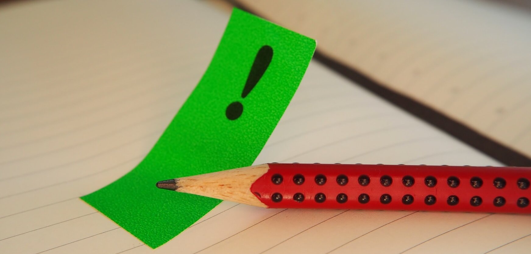 Symbolbild Stellungnahme: Bleistift und Notizzettel