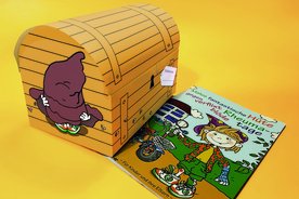 Malu-Kinderbuch neben Trickkiste für Kinder