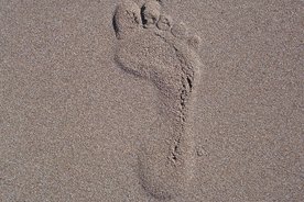 Fußbadruck im Sand